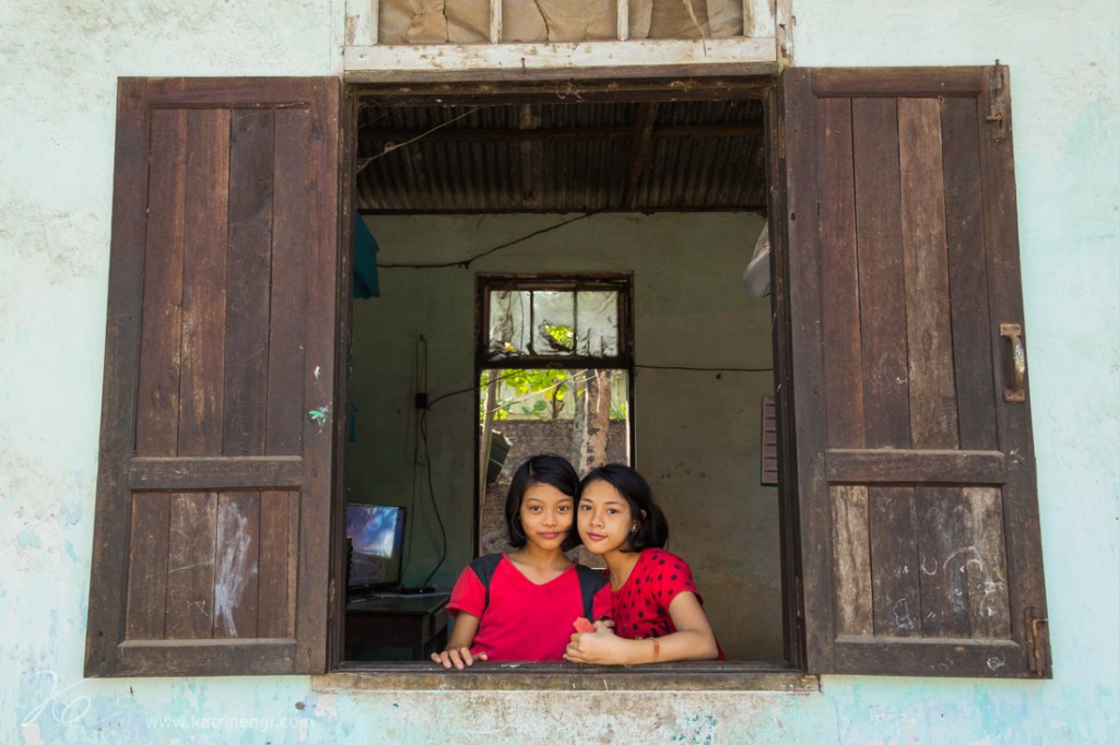 Girls in red best friends in a window