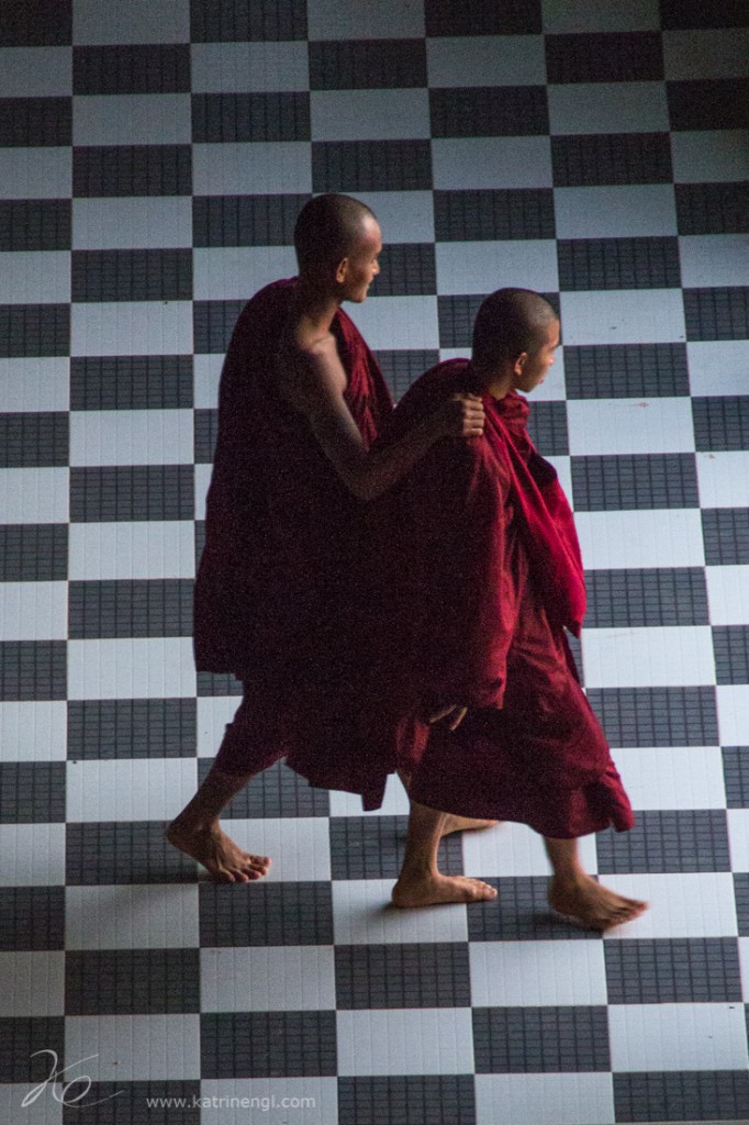 Monks inside of the reclining Buddha